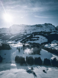 Scenic view of snowcapped mountains against sky during winter
