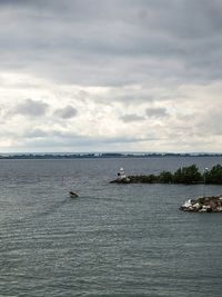 Scenic view of sea against cloudy sky