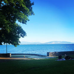 Scenic view of sea against clear blue sky