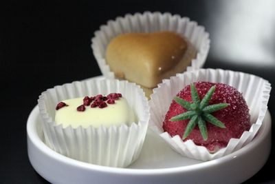 Close-up of chocolate cake against black background