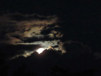 Low angle view of dramatic sky at night