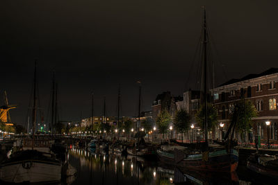 Boats moored at harbor