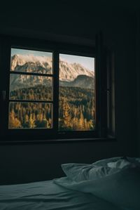 Scenic view of mountains seen through window