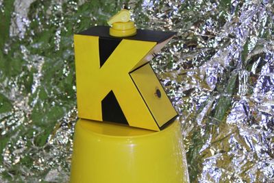 Low angle view of yellow sign