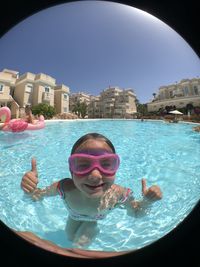 Portrait of boy swimming in pool