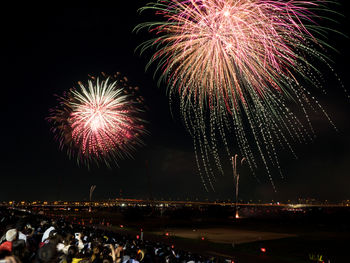 Firework display at night