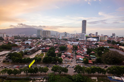 Cityscape against sky at sunset