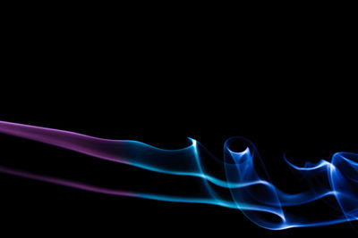 Close-up of smoke against black background