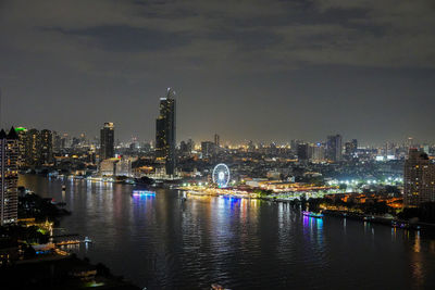 The cityscape and the chao phraya river bangkok in thailand during the night time