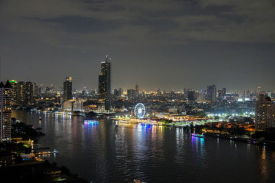 Illuminated buildings in city at night