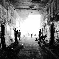 Man cycling in corridor