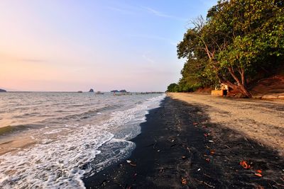 Scenic view of sea against sky at sunset