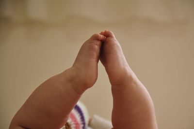 Close-up of child feetd on bed