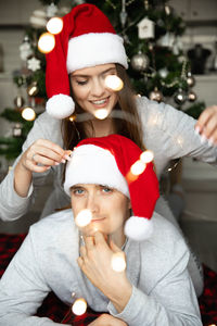 Midsection of woman holding christmas decoration