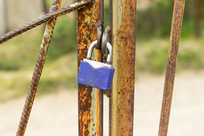 Close-up of padlocks on fence