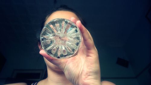 Low angle view of cropped hand