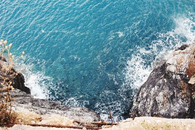 High angle view of rocks in sea