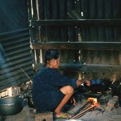 Man working on barbecue grill