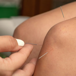 Cropped hand of doctor examining patient