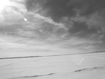 Scenic view of snowcapped landscape against sky