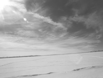 Scenic view of snowcapped landscape against sky