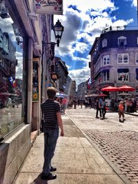 Woman standing on city street