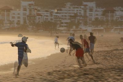 People playing on beach