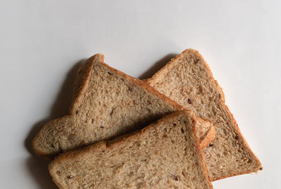 Close-up of bread against white background