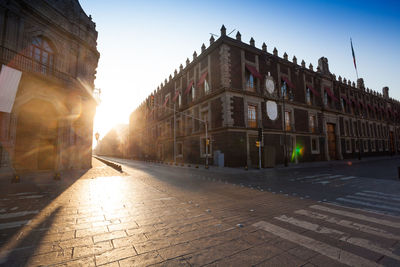 Street amidst buildings against sky