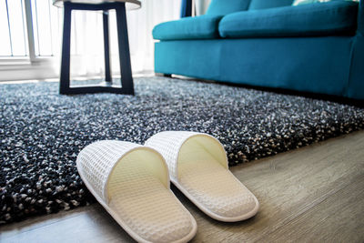 High angle view of chair on rug at home
