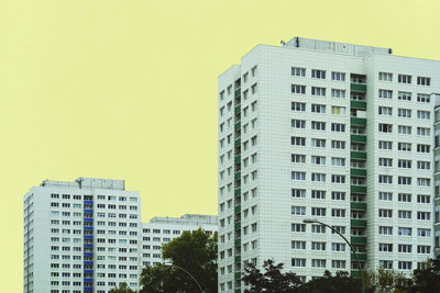 Low angle view of office buildings against clear sky