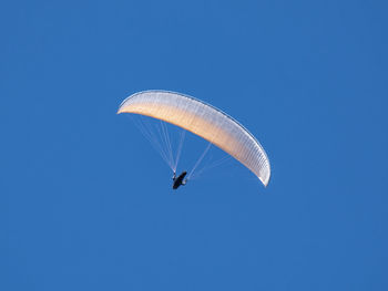 Paraglider flying in the sky