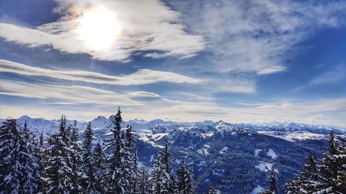 Scenic view of snowcapped mountains against sky