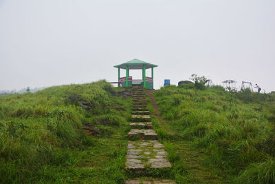 Built structure on field against clear sky