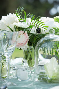 Close-up of flowers in water on table