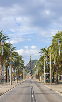 Paseo de colon in barcelona with the montjuic mountain behind it