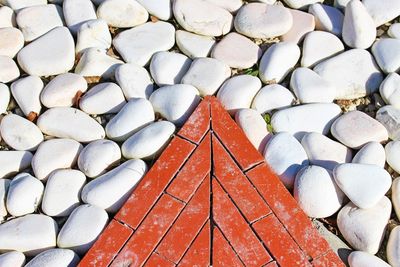 Close-up of pebbles by cobblestones