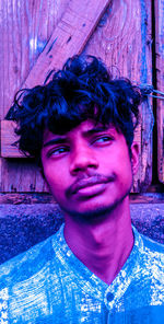 Portrait of young man smiling outdoors