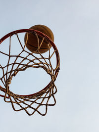 Low angle view of basketball hoop against clear sky