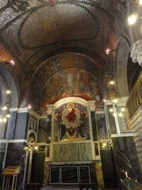 Low angle view of illuminated ceiling