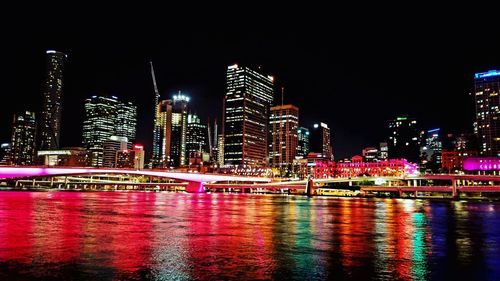 Illuminated city lit up at night