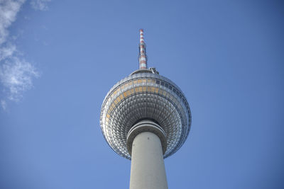 Low angle view of communications tower against sky