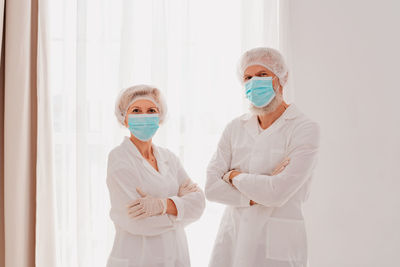 Low angle view of two women standing against sky