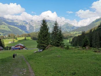 Scenic view of landscape and mountains against sky