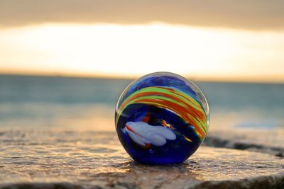 Close-up of multi colored ball on beach