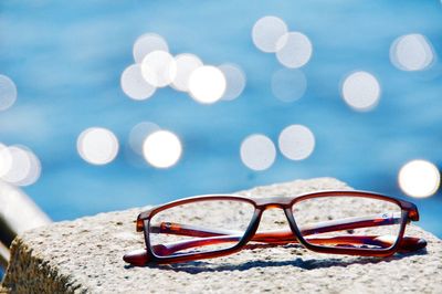 Close-up of sunglasses against blurred background