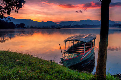 Scenic view of lake against sky during sunset