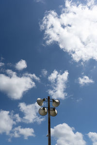 Low angle view of street light against sky