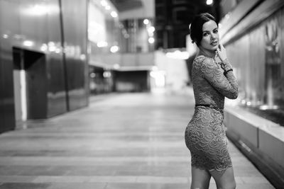 Woman standing on street in city