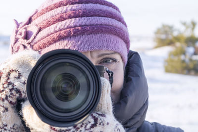 Portrait of a photographer with a camera on his face